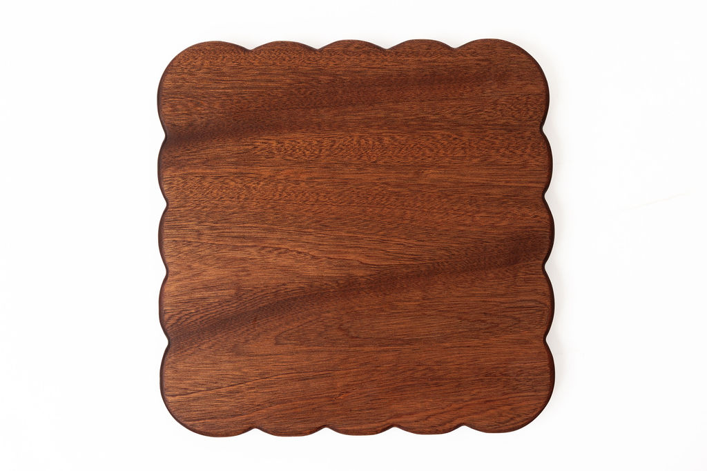 handcrafted scalloped edge cutting boards in sapele - displaying decorative wavy edges and natural wood grain patterns