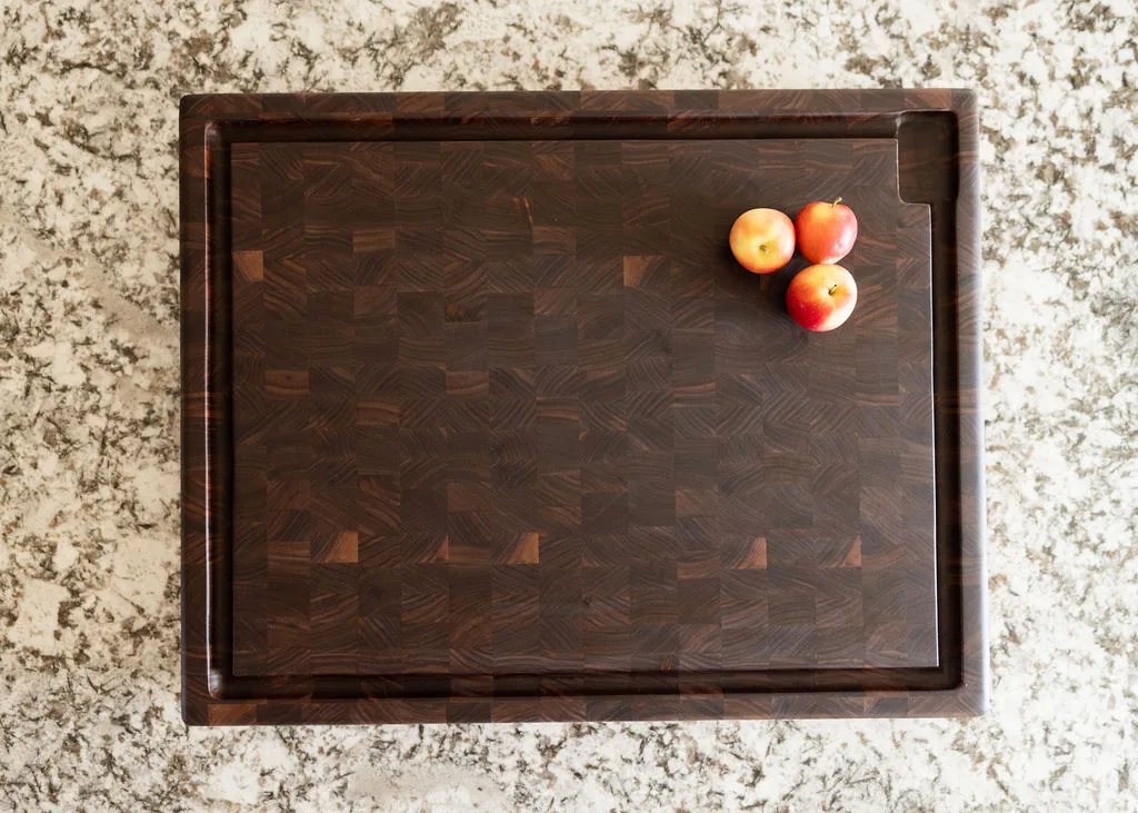 A solid walnut end-grain cutting board styled with food and ingredients — beth & co. woodworks, Sierra Vista, AZ