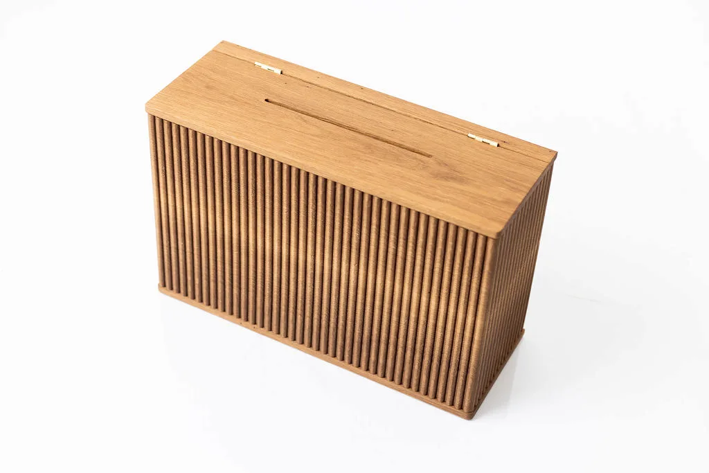 Interior view of a custom lockable donation box in solid white oak showing interior construction and locking mechanism — beth & co. woodworks, Sierra Vista, AZ